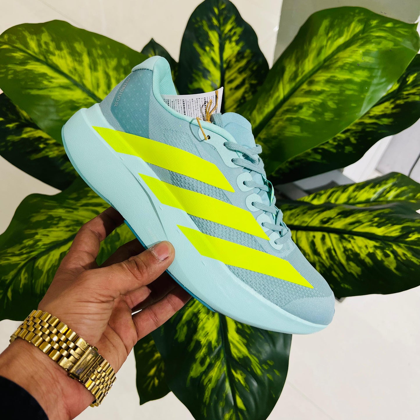 Shoes adidas Adizero Evo SL in the Semi Flash Aqua and Lucid Lemon colorway blue neon
